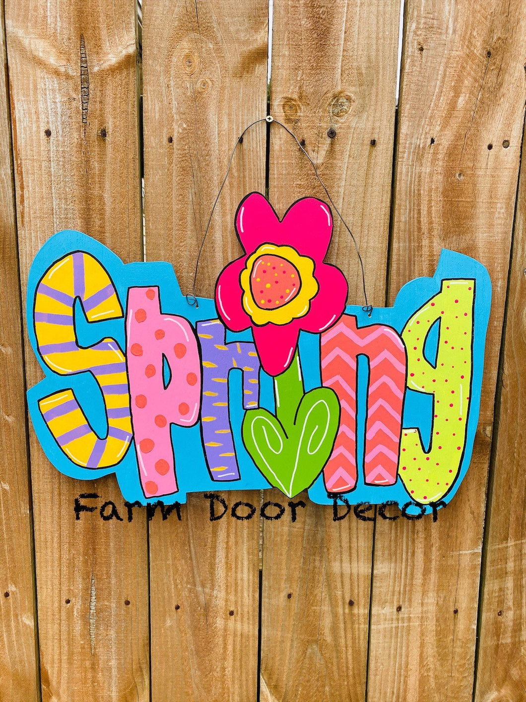 Spring door hanger